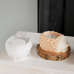 Detail view of hedgehog silicone mold with textured finish and finished wax candle piece