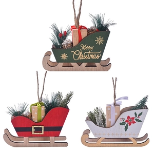 Three decorative wooden Christmas sled ornaments with pine needles and ribbon in a vertical row