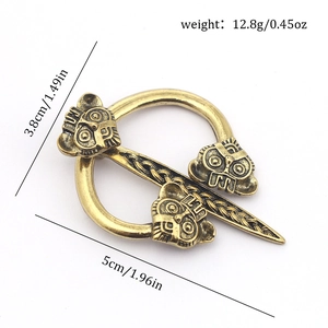 Detail view of vintage bronze Viking brooch showing dimensions 5x3.8cm and 12.8g weight