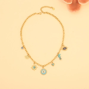 Detailed view of gold stainless steel necklace with evil eye, sun, and heart charms