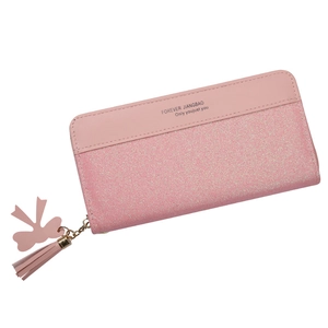 Pink patchwork zip wallet with glitter detail, tassel charm and bow accent for women