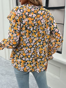 Rear view of floral long sleeve shirt with ruffle trim and back button detail
