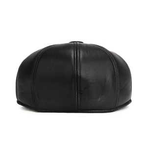 Rear view of black leather newsboy cap for men featuring premium textured finish