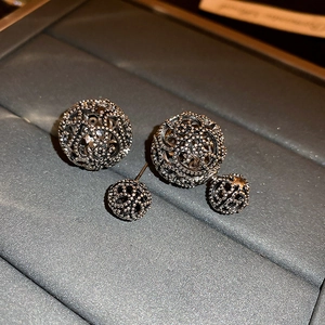 Vintage hollow geometric double-sided stud earrings in retro silver with floral texture