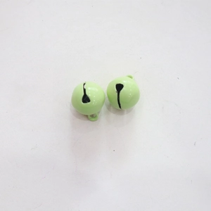 Close-up of two light green painted 14mm metal craft bells for pet collars and DIY crafts
