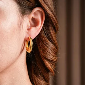 Elegant gold plated chunky round hoop earrings with minimalist irregular wave design for women