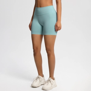 Detail of high-waist ribbed waistband on seamless fitness shorts for tummy support