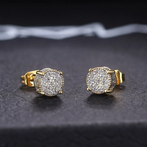 Close-up of gold-plated hip hop stud earrings with micro-pushed cubic zirconia stones