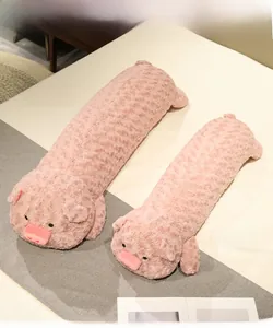 Pink plush pig bolster pillows in 110cm and 90cm sizes on a cozy bed setup