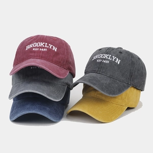Close-up of vintage washed cotton baseball caps with Brooklyn 1631 embroidery detail