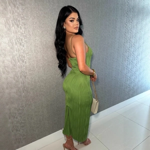 Detail of green bodycon maxi dress with wavy pleated texture and open back design