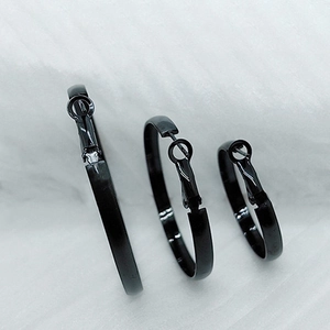 Set of three black polished stainless steel hoop earrings in small, medium, and large sizes