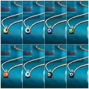 Detailed grid view showing eight colors of evil eye pendants on fine silver chains
