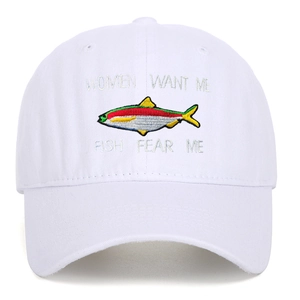 Detailed embroidery of Women Want Me Fish Fear Me text on a white cotton baseball cap