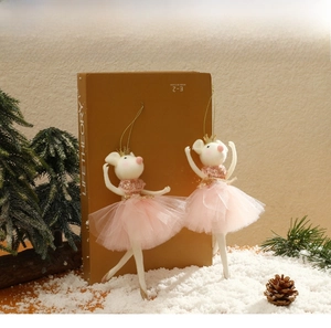 Detail view of two mouse ballet dancer ornaments with pink tulle skirts and gold crowns