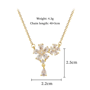 Detailed view of gold flower necklace with zircon inlay and product size specifications
