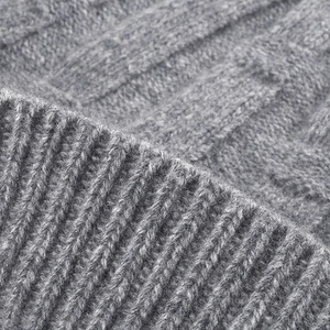Thick grey knitted wool beanie for men and women featuring warm cable knit and ribbed cuff texture