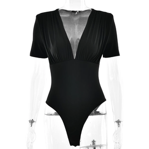 Slim fit black short sleeve bodysuit for women featuring a deep V-neck and ruched texture