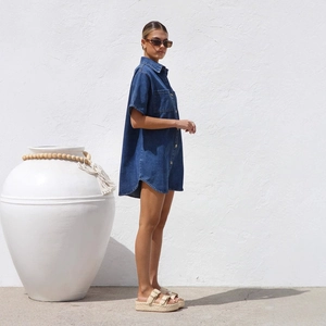 Women's dark blue denim button-down shirt dress with short sleeves and a lapel collar