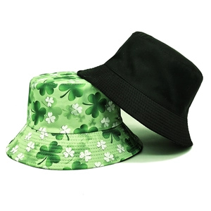 Two-piece reversible sun hat set featuring black canvas and green shamrock patterns