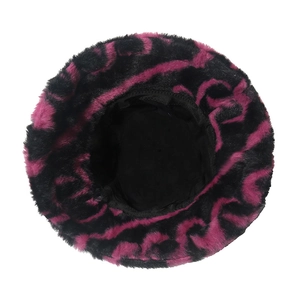 Detailed top view of plush bucket hat with vibrant black and pink wavy animal patterns