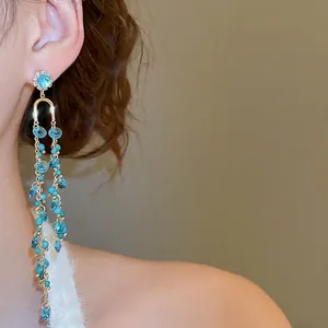Elegant gold tassel earrings with blue crystals and sparkling rhinestone stud for women
