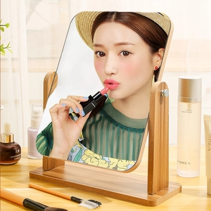 Rotating tabletop wooden makeup mirror with a minimalist design for student dormitories
