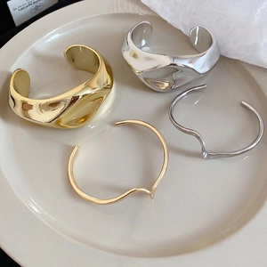 Chic metallic set of gold and silver irregular wrinkled open bangles and wavy bracelets