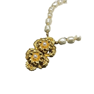 Elegant gold flower pendants on white pearl beaded necklace with vintage design