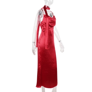 Detailed view of red satin slip dress fabric texture with matching long neck scarf