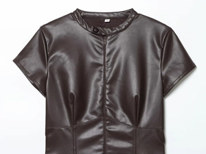 Detail of dark brown PU leather top featuring round neck, size S tag, and zipper closure