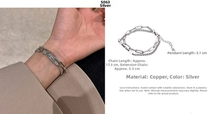 Detail of silver double-layer bracelet with Good Luck tag and adjustable chain length
