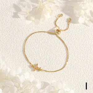 Adjustable gold box chain bracelet featuring a sparkling zircon-encrusted airplane charm