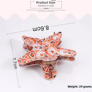 Detailed top view of a star-shaped Christmas shark clip featuring snowman and festive patterns