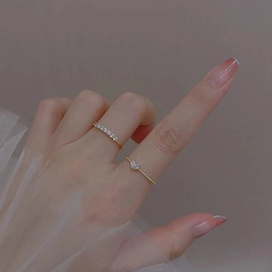 Exquisite gold-plated heart ring set featuring sparkling zircon stones on female model hand