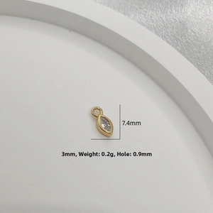 Detailed macro of gold marquise pendant with CZ stone for DIY jewelry 7.4x3mm