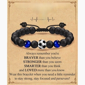 Detail of soccer beaded bracelet with inspirational card and black tiger eye beads