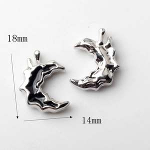 Detailed view of silver crescent moon charms with 18mm height and 14mm width dimensions