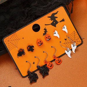 Halloween earring set featuring pumpkin and ghost studs on a themed display card