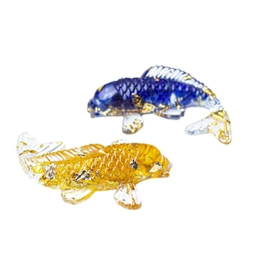 Natural crystal resin koi fish ornaments with gold foil decoration on white background