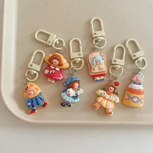 Set of 6 cute cartoon girl resin keychains with colorful dresses and matte lobster clasps