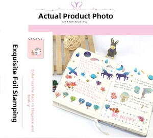 Detailed view of gold foil decorative stickers with dreamlike unicorn and dolphin patterns