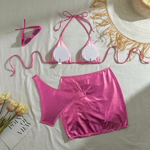 Three-piece metallic pink bikini set featuring a drawstring halter top and matching mini skirt