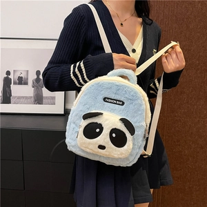 Detail of light blue plush panda backpack showing soft fabric and cute design