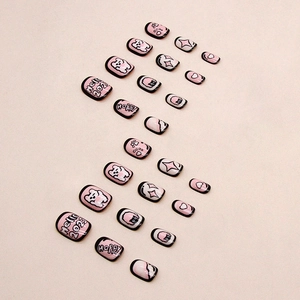 Pink cartoon bear and paw print press-on nails with Y2K heart designs and black outlines