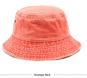 Detail view of washed orange red cotton bucket hat showing stitching and metal eyelets