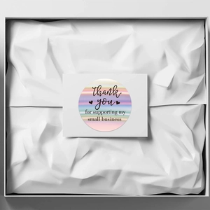 Rainbow laser thank you labels for small business packaging inside a gift box