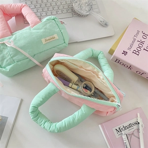 Detailed top view of quilted macaron color stationery bags with soft padded handles