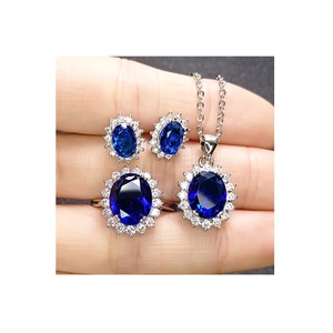 Royal blue sapphire sunflower jewelry set including earrings, pendant, and ring for women