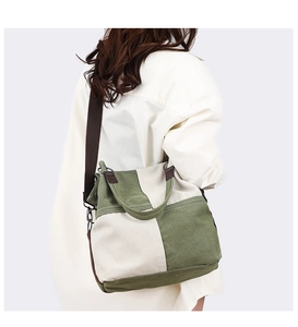 Side view of olive green and beige patchwork canvas tote bag on female model